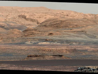 The dark band in the lower portion of this Martian scene is part of the "Bagnold Dunes" dune field lining the northwestern edge of Mount Sharp. The scene combines multiple images taken with the Mast Camera on NASA's Curiosity Mars rover on Sept. 25, 2015. The view is toward south-southeast.