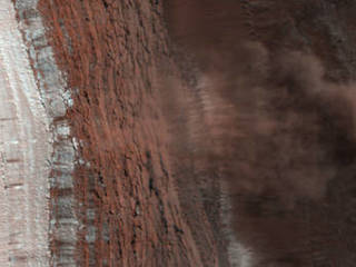 Amazingly, this HiRISE image has captured at least four avalanches, or debris falls, in action.