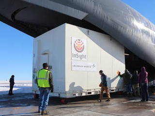 A crate containing NASA's Mars-bound InSight spacecraft is loaded into a C-17 cargo aircraft at Buckley Air Force Base, Denver, for shipment to Vandenberg Air Force Base, California.