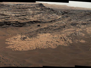 This May 22, 2015, view from the Mast Camera (Mastcam) in NASA's Curiosity Mars rover shows the "Marias Pass" area where a lower and older geological unit of mudstone -- the pale zone in the center of the image -- lies in contact with an overlying geological unit of sandstone.