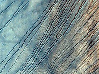 The Russell Crater dune field is covered seasonally by carbon dioxide frost. This image shows the dune field after the frost has sublimated, or evaporated directly from solid to gas. There are just a few patches left of the bright seasonal frost.