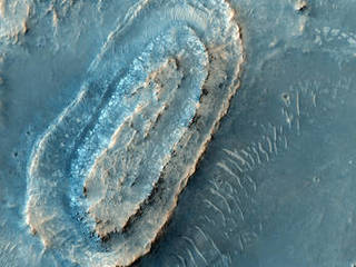 This image lies in the middle of a candidate landing site in the Northeast part of Syrtis Major, a huge shield volcano, and near the Northwest rim of Isidis Planitia, a giant impact basin.