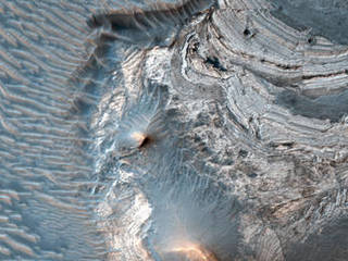 The rock layers in this image were likely horizontal when the materials were first deposited, but are now tilted to high angles, approaching 90 degrees.