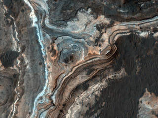 This image shows part of Ladon Vallis, a long outflow channel found in the Southern Highlands on Mars.