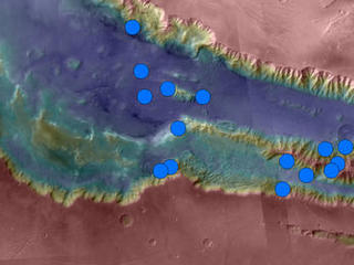 Blue dots on this map indicate sites of recurring slope lineae (RSL) in part of the Valles Marineris canyon network on Mars. RSL are seasonal dark streaks that may be indicators of liquid water. The area mapped here has the highest density of known RSL on Mars.