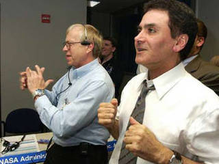 Dr. Ed Weiler, associate administrator, Office of Space Science, NASA Headquarters  and Mars Exploration Program manager, Dr. Firouz Naderi (right) are delighted with the news of Opportunity's safe entry, descent and landing on Mars.