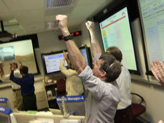 From left: Dave Lavery, program executive for Solar System Exploration at NASA Headquarters, Dr. Ed Weiler, associate administrator, Office of Space Science, NASA Headquarters, Pete Theisinger, (former) Mars Exploration Rover project manager and JPL lab director, Dr. Charles Elachi celebrate the success of Spirit's landing and transmission of first images.