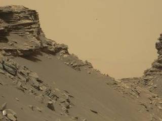 Curiosity viewed sloping buttes and layered outcrops as it exited the "Murray Buttes" region on lower Mount Sharp, Sept. 9, 2016.