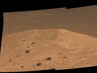 This Sept. 21, 2016, scene from the panoramic camera (Pancam) on NASA's Mars Exploration Rover Opportunity shows "Spirit Mound" overlooking the floor of Endeavour Crater. The mound stands near the eastern end of "Bitterroot Valley" on the western rim of the crater, and this view faces eastward.