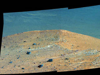 This Sept. 21, 2016, scene from the panoramic camera (Pancam) on NASA's Mars Exploration Rover Opportunity shows "Spirit Mound" overlooking the floor of Endeavour Crater. The mound stands near the eastern end of "Bitterroot Valley" on the western rim of the crater, and this view faces eastward.