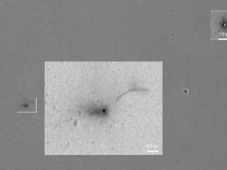 This Oct. 25, 2016, image from the HiRISE camera on NASA's Mars Reconnaissance Orbiter shows the area where the Europe's Schiaparelli test lander struck Mars, with magnified insets of three sites where spacecraft components hit the ground. It adds detail not seen in earlier imaging of the site.