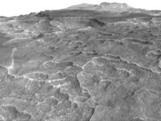 This vertically exaggerated view shows scalloped depressions in a part of Mars where such textures prompted researchers to check for buried ice, using ground-penetrating radar aboard NASA's Mars Reconnaissance Orbiter. They found about as much frozen water as the volume of Lake Superior.
