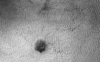 This sequence of three HiRISE images from NASA's Mars Reconnaissance Orbiter shows the growth of a branching network of troughs carved by thawing carbon dioxide over the span of three Martian years. This process may also form larger radially patterned channel features known as Martian "spiders."