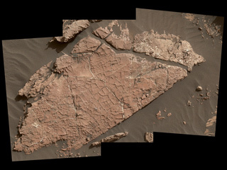 The network of cracks in this Martian rock slab called "Old Soaker" may have formed from the drying of a mud layer more than 3 billion years ago. The view spans about 3 feet (90 centimeters) left-to-right and combines three images taken by the MAHLI camera on the arm of NASA's Curiosity Mars rover.