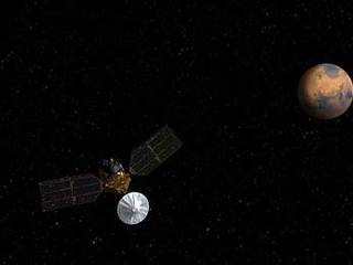 Artist's concept of Mars Reconnaissance Orbiter approaching Mars.