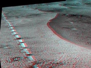 This view of a 90-foot-wide, relatively fresh crater on Mars, "Orion Crater," combines images from the left eye and right eye of the Panoramic Camera (Pancam) on NASA's Mars Exploration Rover Opportunity. It appears three-dimensional when seen through blue-red glasses with the red lens on the left.