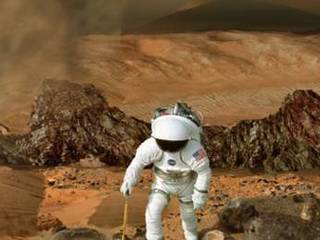 This image shows a backward-looking view of an astronaut in a white spacesuit hiking over reddish sand and rocks on Mars. A gray plume of smoke rises from a fumarole behind the astronaut.