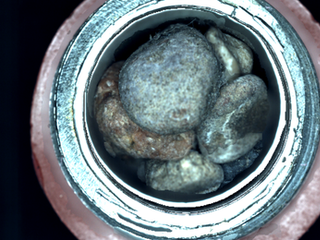 This is the top-down view into a sample tube is the type of image CacheCam provides to the Mars 2020 team.