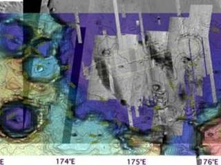 Details of the Gusev Crater designated landing site are added with topographic information and higher-resolution imaging from instruments on the Mars Global Surveyor and Mars Odyssey orbiters.