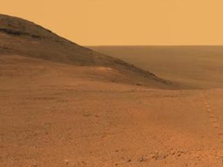 This June 2017 view  from the Pancam on NASA's Opportunity Mars rover shows the area just above  "Perseverance Valley" on a large crater's rim. A broad notch in the  crest of the rim, at right, might have been a spillway for a fluid that carved  the valley, out of sight on the other side of the rim.