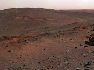 This synthetic image of the Spirit Mars Exploration Rover on the flank of "Husband Hill" was produced using "Virtual Presence in Space" technology.