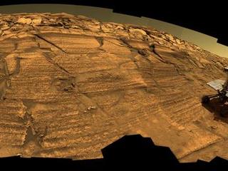 This synthetic image of NASA's Opportunity Mars Exploration Rover inside Endurance Crater was produced using "Virtual Presence in Space" technology.