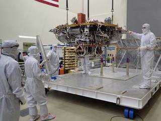 The Mars lander portion of NASA's InSight spacecraft is lifted from the base of a storage container in preparation for testing, in this photo taken June 20, 2017, in a Lockheed Martin clean room facility in Littleton, Colorado.