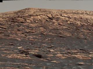 "Vera Rubin Ridge," a favored destination for NASA's Curiosity Mars rover even before the rover landed in 2012, rises near the rover nearly five years later in this panorama from Curiosity's Mastcam. The scene combines 23 images taken with the Mastcam's right-eye camera, on June 22, 2017.