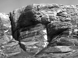This view of "Vera Rubin Ridge" from the ChemCam instrument on NASA's Curiosity Mars rover shows sedimentary layers and fracture-filling mineral deposits. ChemCam's telescopic Remote Micro-Imager took the 10 component images of this scene on July 3, 2017, from a distance of about 377 feet.